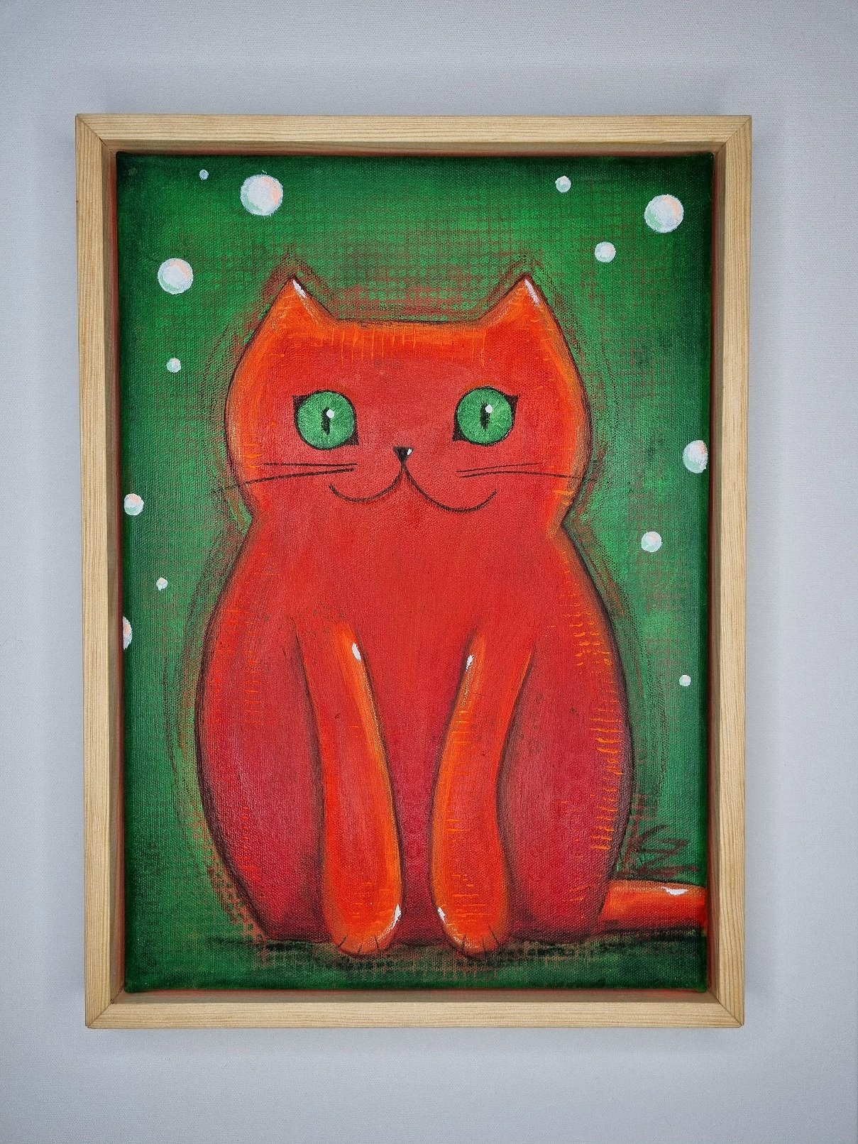 (Neon)Orange Miezekatze auf Grün