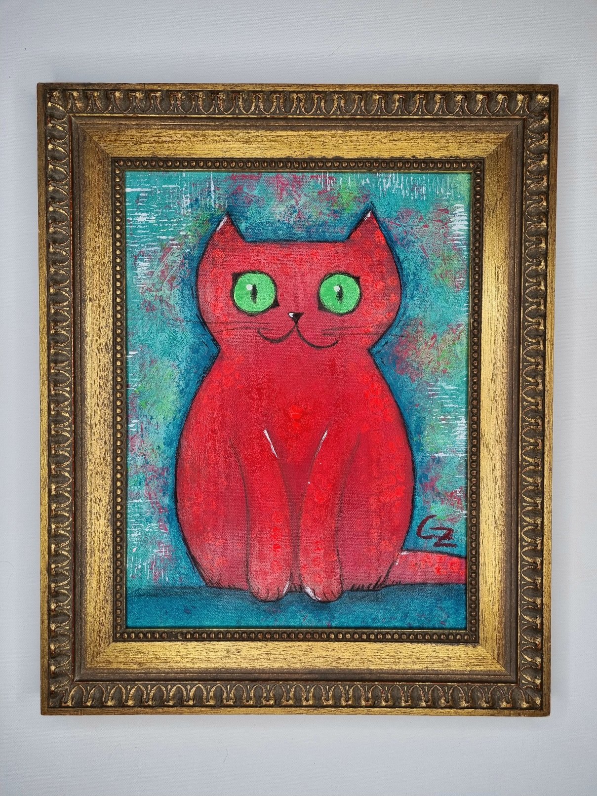 (Neon)Orangepinke Miezekatze auf türkis